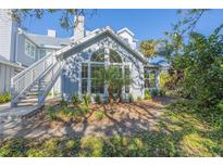 Updated condo building exterior with landscaping and a private staircase at 4278 Sun Village Ct # 27D, New Smyrna Beach, FL 32169