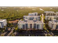 Complex of waterfront condos with parking and lush landscaping at 5300 S Atlantic Ave # 13307, New Smyrna Beach, FL 32169