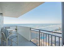 Stunning ocean view from private balcony, featuring table and chairs at 2987 S Atlantic Ave # 903, Daytona Beach, FL 32118