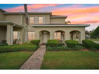 Two-story house with a covered porch and landscaped front yard at 346 N Airport Rd, New Smyrna Beach, FL 32168