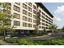 The Flats Orlando: modern building exterior with ample parking at 4849 W Irlo Bronson Hwy # 409, Kissimmee, FL 34746