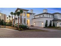 Luxury two-story home with modern design and brick driveway at 4145 Grande Brick Loop # 16, Orlando, FL 32837