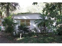 White mobile home with mature landscaping at 770 Snow Hill Rd, Geneva, FL 32732
