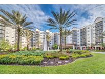 Resort-style community with lush landscaping and water features at 14501 Grove Resort Ave # 1430, Winter Garden, FL 34787