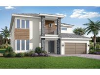 Two story modern home with stone accents at 7517 Excitement Dr, Reunion, FL 34747