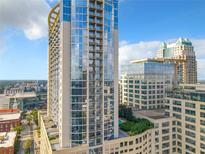 Aerial view of a high rise building in the city at 155 S Court Ave # 2107, Orlando, FL 32801