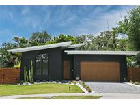 Contemporary home with a sleek design and modern garage at 737 N Capen Ave, Winter Park, FL 32789