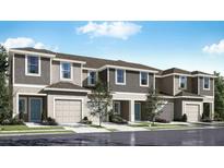 Modern townhome community with attached garages at 4811 Spangle Drive Way, Saint Cloud, FL 34769