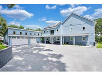 Stunning two-story home with a detached garage and driveway at 1317 Spring Lake Ter, Ocoee, FL 34761