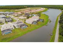 Aerial view of upscale houses, lake, and walking path at 3951 Oakville Ave, Kissimmee, FL 34741