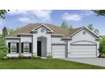 Two-story house with a three-car garage and landscaping at 2505 Lake Ruby Rd, Deland, FL 32724