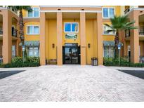 Building exterior with columns and landscaping at 8100 Poinciana Blvd # 2212, Orlando, FL 32821