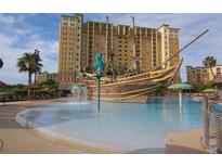 Resort-style pool with pirate ship water feature at 8100 Poinciana Blvd # 2203, Orlando, FL 32821
