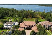 Aerial view of luxury homes and lakefront property at 9139 Tibet Pointe Cir, Windermere, FL 34786