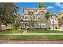 Two-story townhome with front yard and walkway at 28 W Esther St # A, Orlando, FL 32806