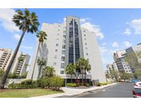 Exterior view of a modern high rise building at 6165 Carrier Dr # 1204, Orlando, FL 32819