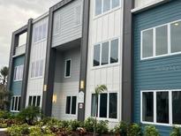 Modern building exterior with gray and blue accents at 7760 Sandy Ridge Dr # 119, Kissimmee, FL 34747