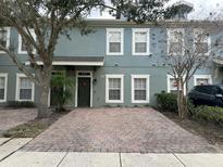 Charming two-story townhome with brick paver driveway at 2433 Caravelle Cir, Kissimmee, FL 34746