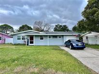 Ranch style home with a blue exterior and yard at 2554 Yale Rd, South Daytona, FL 32119