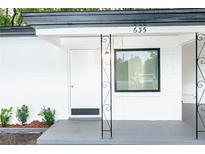White house with black trim and small porch at 635 Maitland Ave, Altamonte Springs, FL 32701
