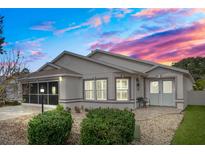 Inviting one-story home with a landscaped yard and neutral color palette at 9076 Sw 95Th Ave # 9076, Ocala, FL 34481