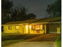 Night view of single-story home with driveway at 2114 N Hastings St, Orlando, FL 32808