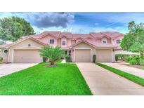 Two-story townhouses with attached garages at 28 Golf Villa Dr, Port Orange, FL 32128