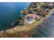 Luxury waterfront home with a pool and expansive lake views at 4200 Down Point Ln, Windermere, FL 34786