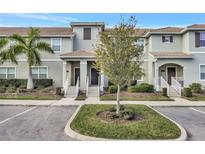 Two-story townhome with parking and landscaping at 4815 Lullaby Ln, Kissimmee, FL 34746