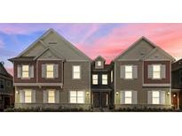 Three-story townhouses with a modern design, showcasing appealing exterior at 7538 Sunville Ave, Kissimmee, FL 34747