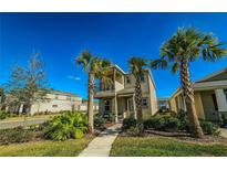 Two-story home with balcony and tropical landscaping at 728 Costa Ln, Debary, FL 32713
