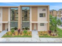 Modern two-story townhouse with large windows at 3062 Rockefeller Way, Kissimmee, FL 34747
