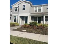Beautiful two-story home with landscaping and a walkway at 14563 Orchid Island Dr, Orlando, FL 32827