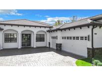 Stunning modern home exterior with a two-car garage and attractive landscaping at 32702 View Haven Ln, Sorrento, FL 32776