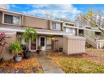 Townhouse exterior with walkway and landscaping at 5089 Eaglesmere Dr # D09, Orlando, FL 32819