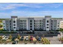 Modern building exterior with ample parking at 3191 Paradox Cir # 202, Kissimmee, FL 34746