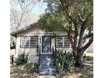Quaint one-story home with front steps and landscaping at 1414 Johns Ave, Haines City, FL 33844