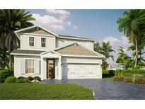 Two-story home with two-car garage and landscaping at 106 Elena Lavin Cir # 16, Orlando, FL 32807