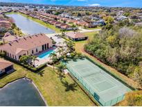 Aerial view showing community pool and tennis courts at 1566 Vienna Square Dr, Winter Haven, FL 33884