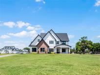 Stunning two-story home with brick and white siding at 4508 Packard S Ave, St Cloud, FL 34772