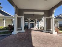 Elegant community entrance with covered walkway at 3174 Feltrim Pl # 201, Kissimmee, FL 34747