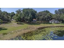 Aerial of house and surrounding lakefront property at 4790 Anderson Rd, Orlando, FL 32812