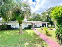 Charming ranch-style home with well-manicured lawn at 2308 Lake Helen Osteen Rd, Deltona, FL 32738