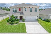 Two-story house with a two-car garage at 418 Anne St, Deland, FL 32724
