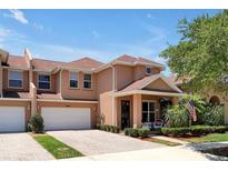 Two-story townhome with two-car garage and front porch at 3587 Casalta Cir, New Smyrna Beach, FL 32168