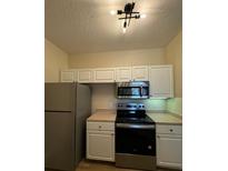 Modern kitchen with stainless steel appliances at 5500 Metrowest Blvd # 304, Orlando, FL 32811