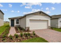 Single-story home with two-car garage at 1357 Current Pl, Haines City, FL 33844