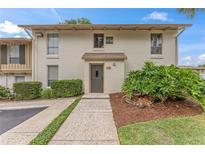 Exterior of condo building with manicured landscaping and walkway at 200 Maitland Ave # 20, Altamonte Springs, FL 32701