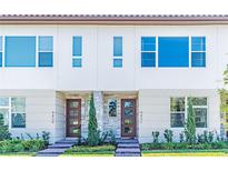 Modern townhouses with stylish stone accents and landscaping at 9832 Bucklow Hill Dr, Orlando, FL 32832