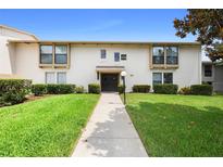 Condo building exterior with walkway and landscaping at 200 Maitland Ave # 174, Altamonte Springs, FL 32701